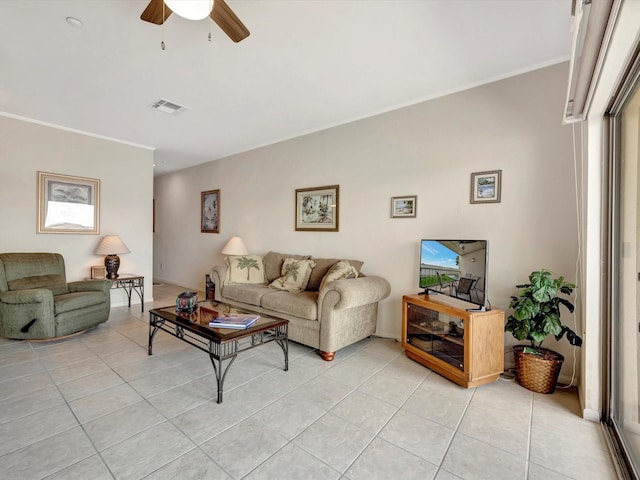 tiled living room with ceiling fan