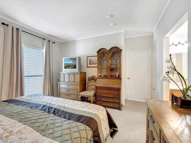 bedroom with crown molding and light colored carpet