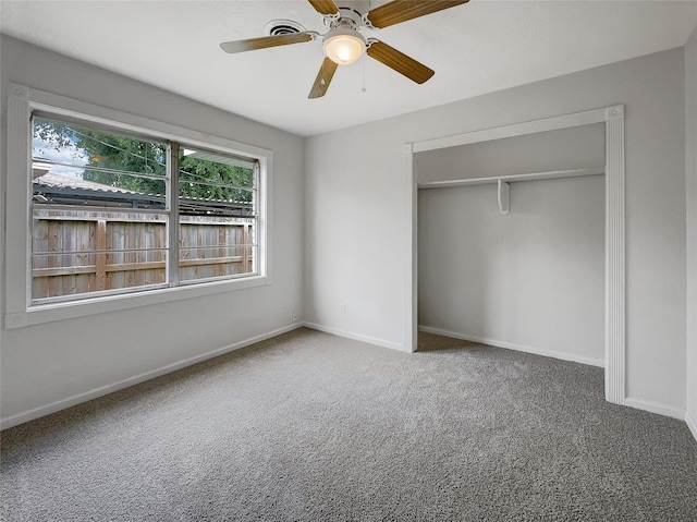 unfurnished bedroom featuring a closet, ceiling fan, and carpet