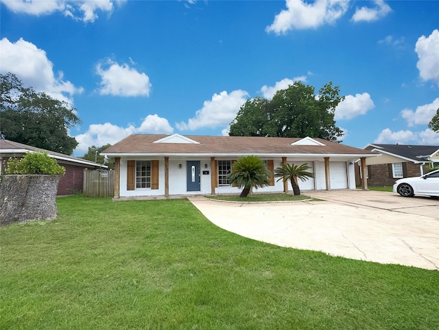 single story home with a garage and a front lawn