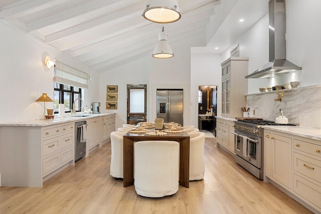 kitchen featuring beam ceiling, stainless steel appliances, light stone counters, decorative backsplash, and wall chimney exhaust hood