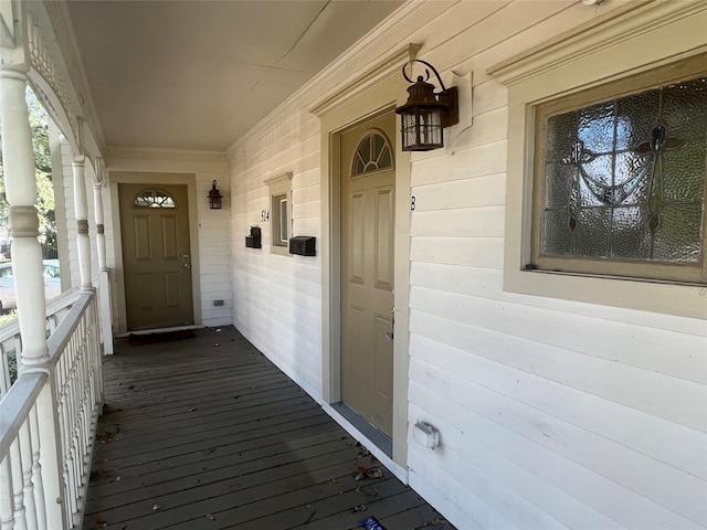 doorway to property featuring covered porch