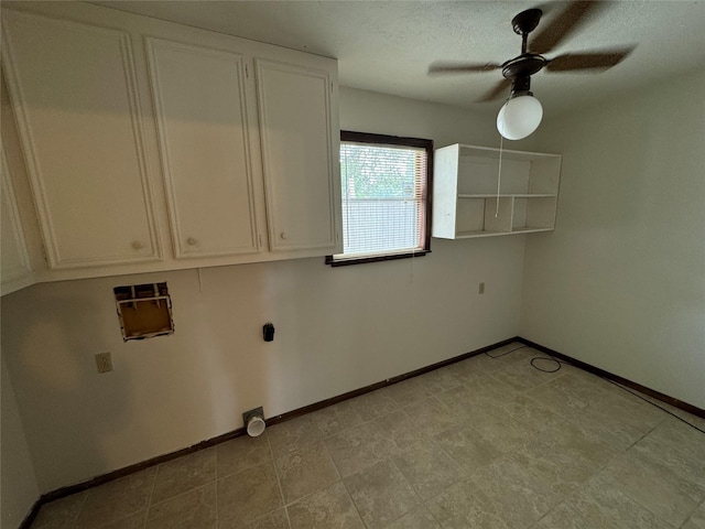 laundry room featuring cabinets, a textured ceiling, and ceiling fan