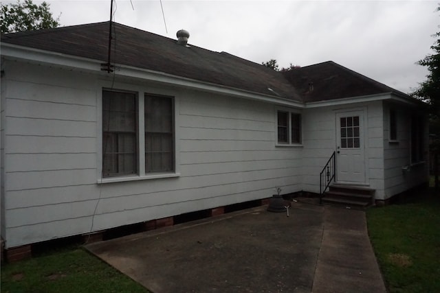 view of side of home with a patio