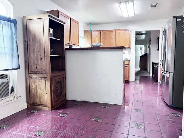 13074 Clover Ln, Iola, TX 77861 - kitchen with kitchen peninsula and stainless steel refrigerator