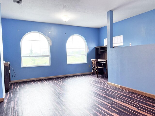 13074 Clover Ln, Iola, TX 77861 - interior space featuring dark hardwood / wood-style floors and a wealth of natural light