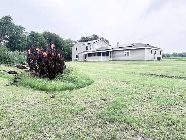 13074 Clover Ln, Iola, TX 77861 - view of yard featuring a sunroom