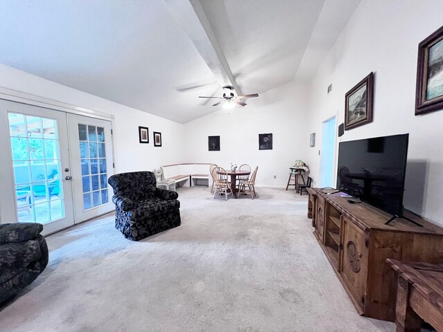 13074 Clover Ln, Iola, TX 77861 - living room with vaulted ceiling with beams, ceiling fan, light colored carpet, and french doors