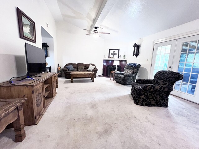 13074 Clover Ln, Iola, TX 77861 - carpeted living room featuring french doors, lofted ceiling with beams, and ceiling fan
