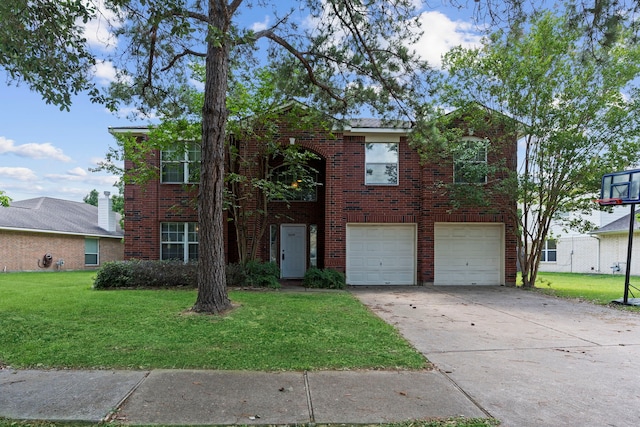 view of front of home with a garage and a front yard