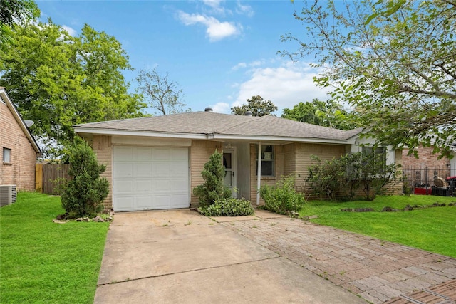 single story home with a front yard and a garage