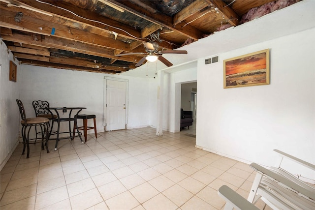 basement with ceiling fan