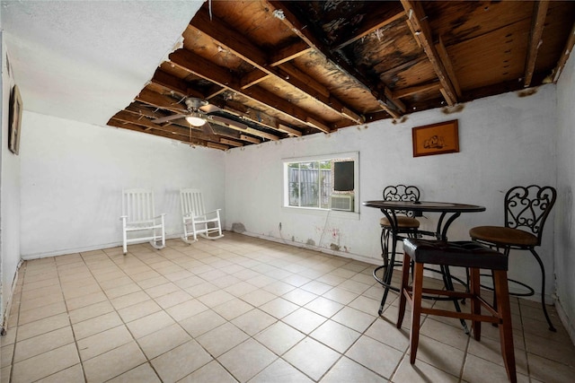 interior space with ceiling fan and cooling unit