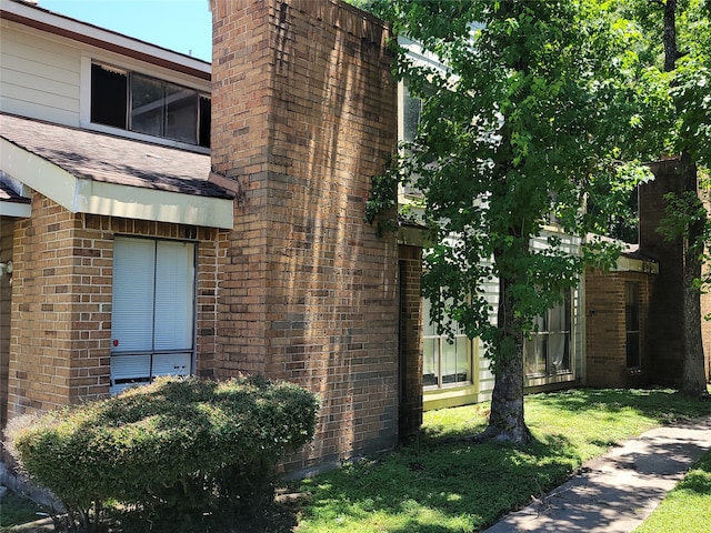 view of property exterior featuring a yard