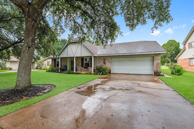 view of front of house with a garage and a front yard