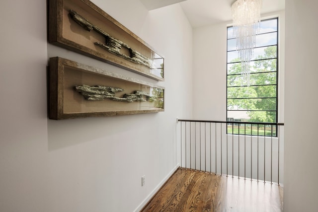 interior space featuring hardwood / wood-style flooring and a chandelier