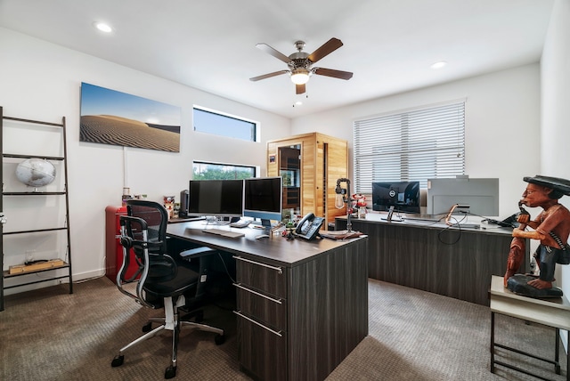 carpeted office featuring ceiling fan