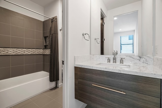 bathroom featuring shower / bath combination with curtain, vanity, and tile patterned flooring