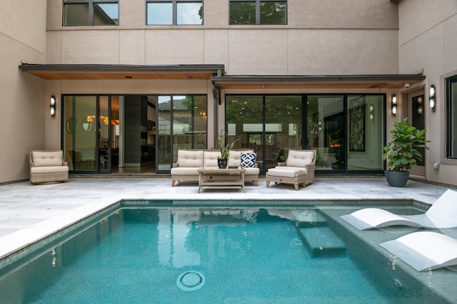 view of swimming pool with a patio