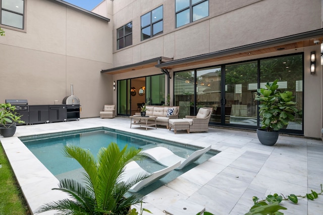 view of swimming pool with a grill, a patio area, and outdoor lounge area