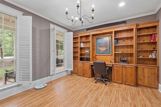 office space featuring light wood-type flooring, built in desk, a chandelier, and crown molding