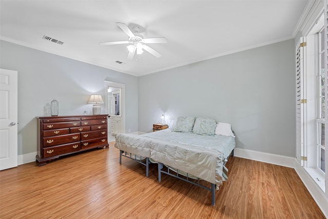 bedroom featuring crown molding, ceiling fan, and light hardwood / wood-style flooring