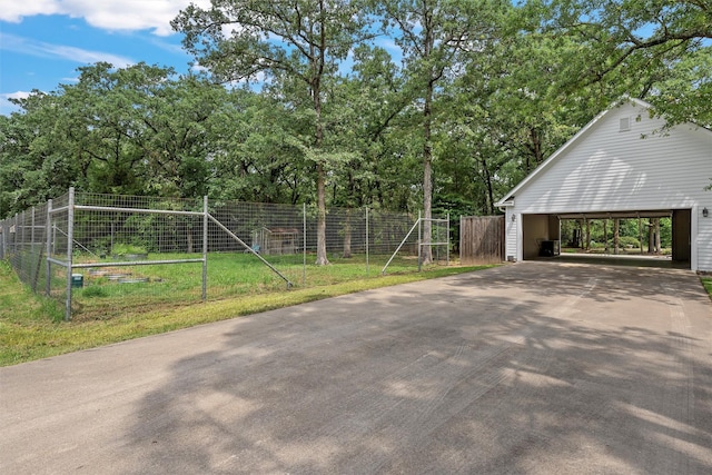 view of property exterior featuring a yard and fence