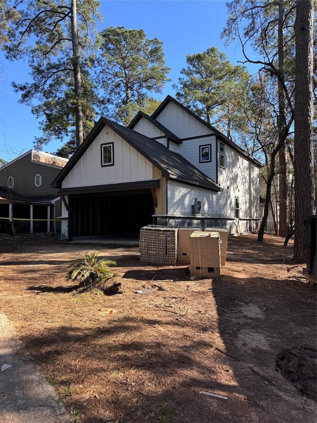 view of side of home with a garage