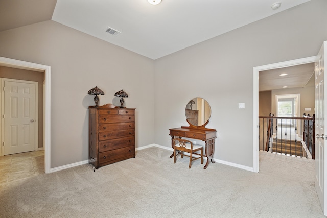 living area with light carpet and vaulted ceiling