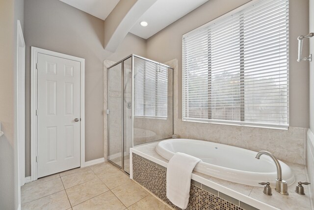 bathroom featuring shower with separate bathtub, tile patterned floors, and plenty of natural light