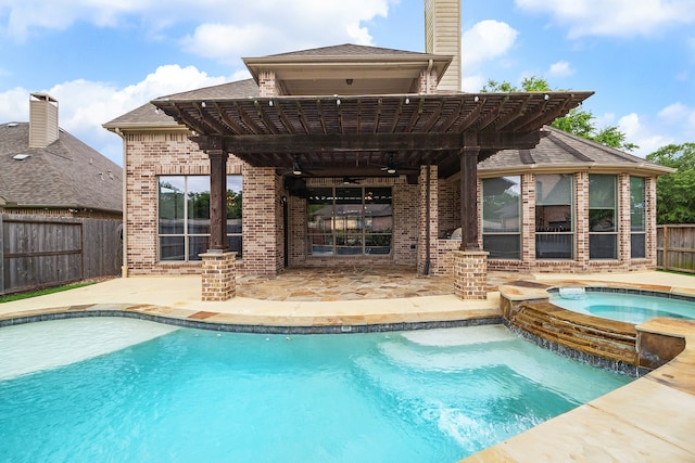 view of swimming pool with an in ground hot tub and a patio