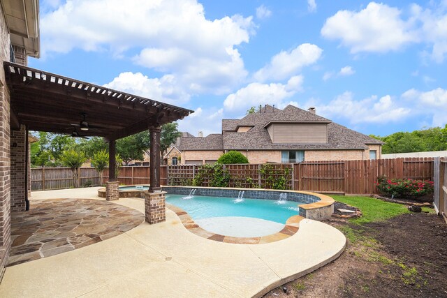 view of pool featuring pool water feature, ceiling fan, a pergola, and a patio