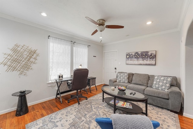 living room featuring hardwood / wood-style floors, ceiling fan, and crown molding