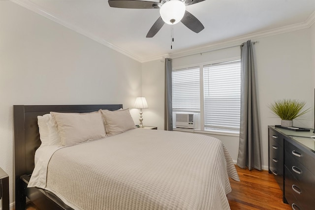 bedroom with ceiling fan, cooling unit, dark hardwood / wood-style flooring, and crown molding