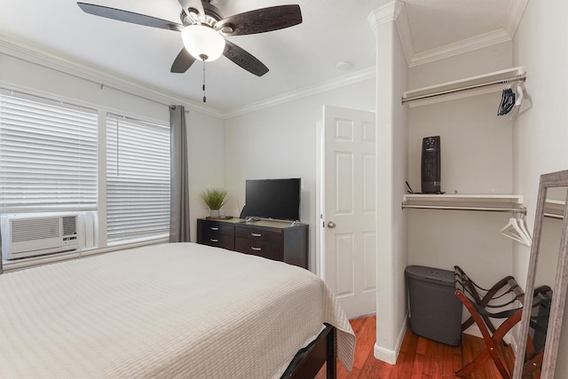 bedroom featuring dark hardwood / wood-style flooring, cooling unit, ceiling fan, and ornamental molding