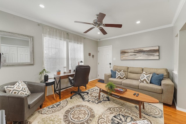 office area featuring ceiling fan, wood-type flooring, and crown molding