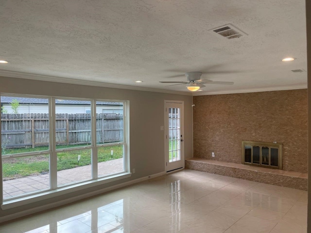 empty room with ceiling fan, light tile patterned flooring, a textured ceiling, and ornamental molding