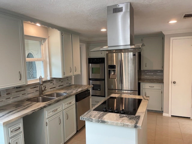 kitchen with a center island, sink, island exhaust hood, light tile patterned flooring, and appliances with stainless steel finishes