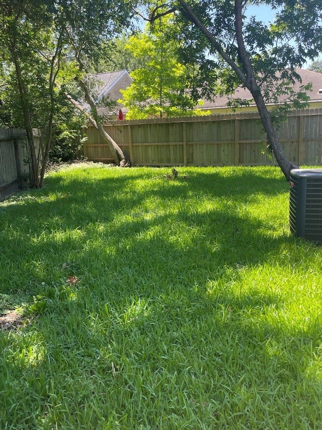 view of yard with central AC unit