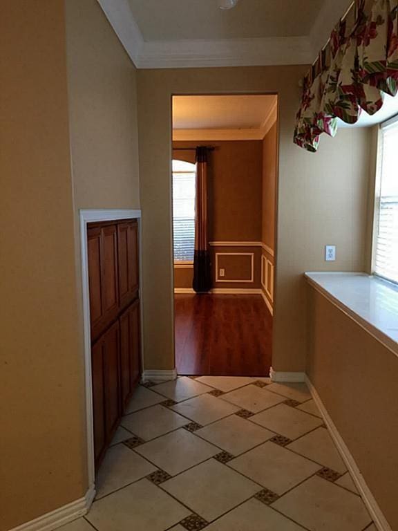 hall featuring ornamental molding