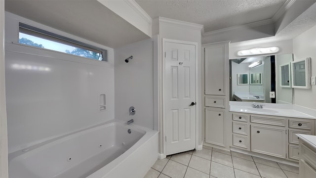 bathroom featuring tile patterned flooring, bathing tub / shower combination, a textured ceiling, vanity, and ornamental molding