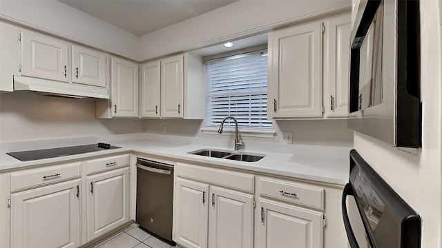 kitchen with white cabinetry, sink, and black electric cooktop