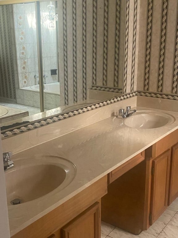 bathroom with tile floors and double vanity