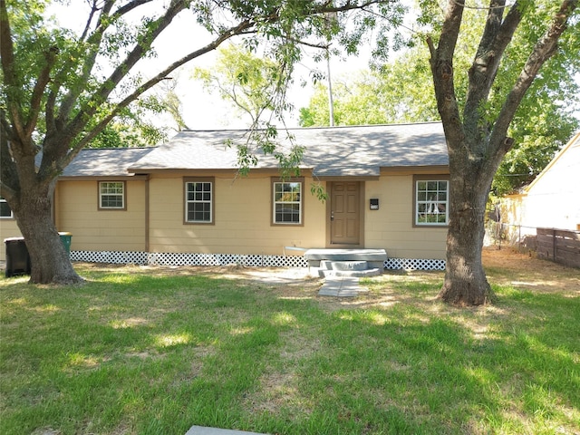 rear view of house with a lawn