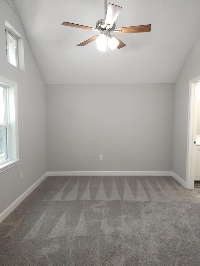 additional living space featuring ceiling fan, plenty of natural light, carpet, and vaulted ceiling