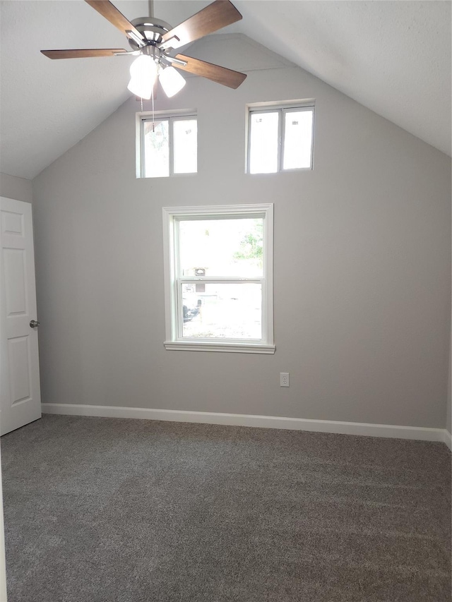 additional living space with carpet flooring, ceiling fan, plenty of natural light, and lofted ceiling