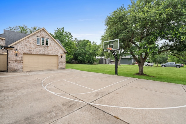 view of basketball court featuring a lawn