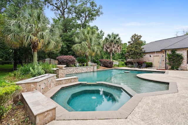 view of swimming pool featuring an in ground hot tub