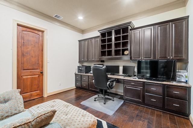 office space with dark hardwood / wood-style flooring, built in desk, and crown molding