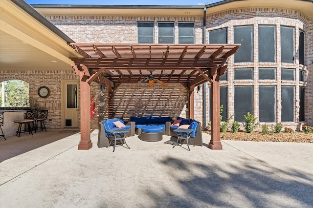 view of community with a pergola, a bar, a patio, and an outdoor hangout area